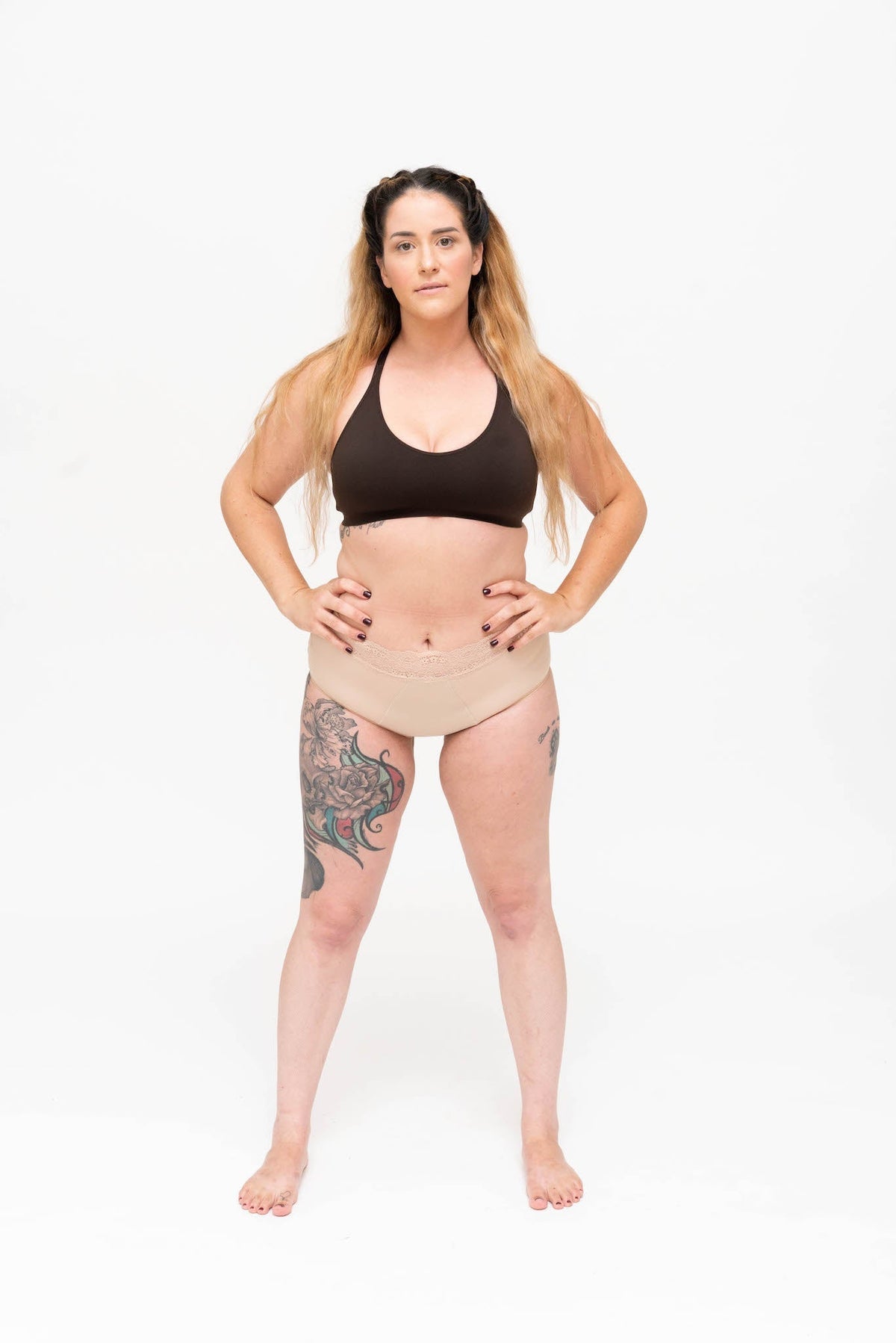 Full figure woman standing in a soft bralette and high waist brief