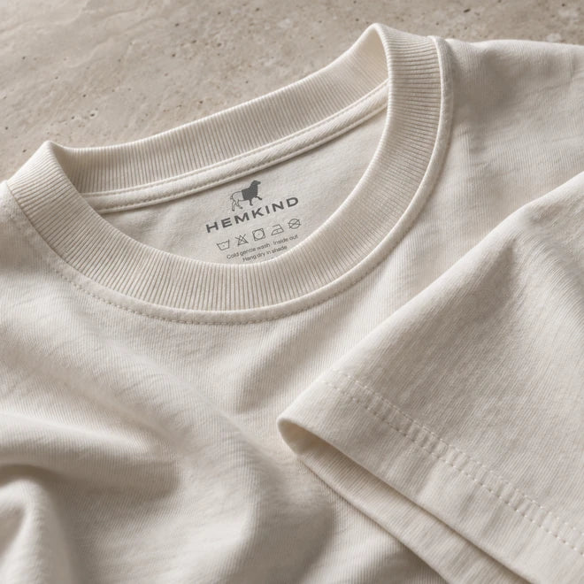 Close view of the ivory Everyday Tee crew neckline and shoulder seams.